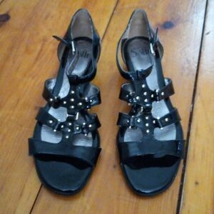 Women's size 8, black patent leather SOFFT ankle strap sandals.